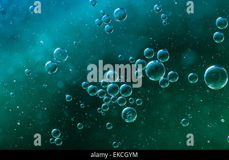 Oil soils on water surface, close-up. Stock Photo