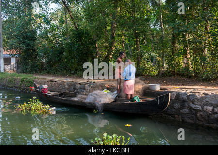 Fishermen at work on the Backwaters of Kumarakom, Kerala India Stock Photo