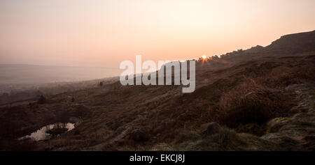 Sunrise over trees and upper tarn on Ilkley Moor Yorkshire from White Wells Stock Photo