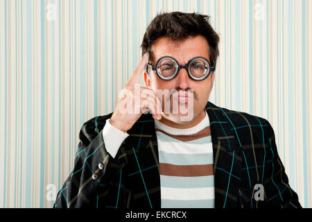 crazy nerd man myopic thinking funny gesture Stock Photo