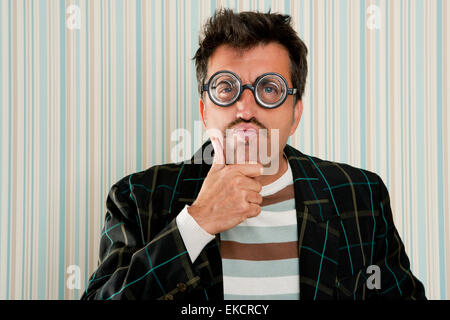 crazy nerd man myopic thinking funny gesture Stock Photo