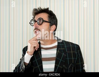 crazy nerd man myopic thinking funny gesture Stock Photo