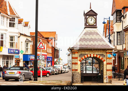 Sheringham town centre Norwich clock tower bus shelter shops shoppers tourists high street Norfolk UK England Stock Photo