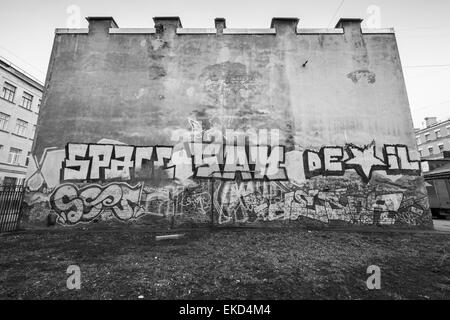 Saint-Petersburg, Russia - April 3, 2015: Graffiti with text on old house wall. Vasilievsky island Stock Photo