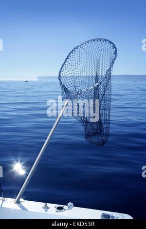 men fishing with triangular scoop net early morning at sunrise