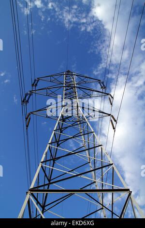 electric mast pole tower pilot on blue cloud sky Stock Photo