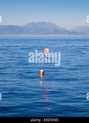 Longliner and trammel net buoy with flag pole Stock Photo