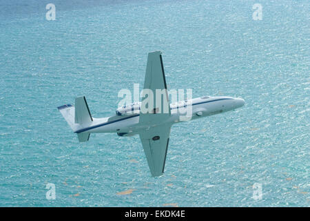 A CBP Air unit Citation Jet is shown patrolling the waters near a ...