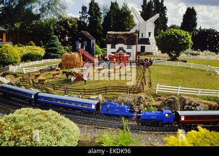Train, farm and windmill at Bekonscot Model Village and Railway. Beaconsfield. Buckinghamshire. England Stock Photo