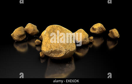 A collection of gold nuggets on an isolated dark background Stock Photo