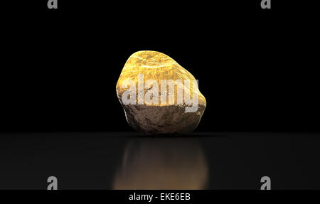 A gold nugget on an isolated dark background Stock Photo