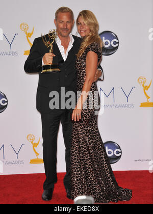 LOS ANGELES, CA - SEPTEMBER 23, 2012: Kevin Costner & wife Christine Baumgartner at the 64th Primetime Emmy Awards at the Nokia Theatre LA Live. Stock Photo