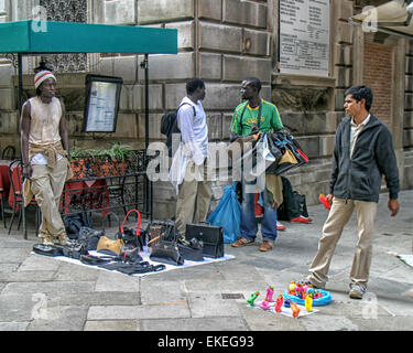 Venice, Province of Venice, ITALY. 6th Oct, 2004. On the streets of Venice immigrant African peddlers show their merchandise. Venice is one of the most popular international tourist destinations. © Arnold Drapkin/ZUMA Wire/Alamy Live News Stock Photo