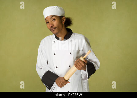 African American Chef Holding Rolling Pin Stock Photo