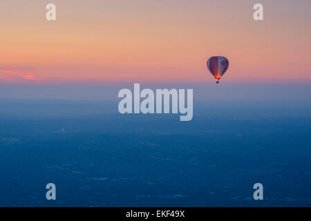 Tourists enjoy hot air balloon flights at sunrise over Melbourne, Australia.