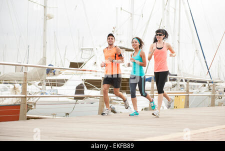 Group of happy runners enjoying some morning exercise Stock Photo