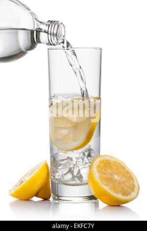 glass full of fresh water with lemon and ice cube, on white background Stock Photo