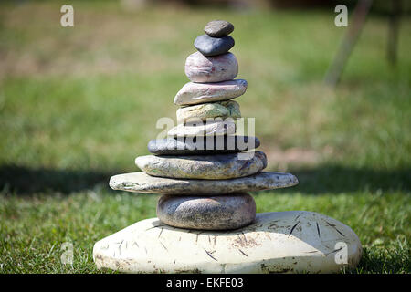 stones piled on each other against the background of grass Stock Photo