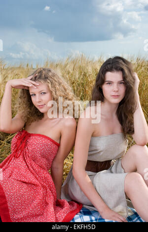 Two beautiful slavonic girls on picnic in wheat field Stock Photo - Alamy