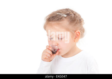 Sick girl taking cough syrup Stock Photo
