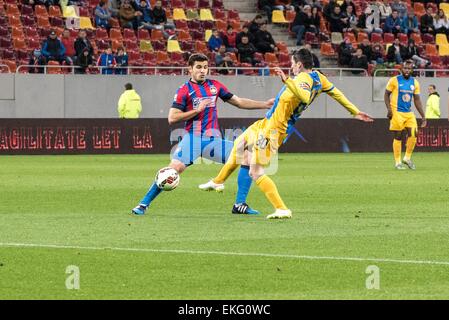 April 9, 2015: Lucian Filip #8 of FCSB L and Laurentiu Marinescu #30 of Petrolul Ploiesti in action during the Liga I game between FC Steaua Bucharest ROU and FC Petrolul Ploiesti ROU at National Arena, Romania ROU. Catalin Soare/www.sportaction.ro Stock Photo