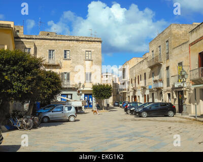 Favignana, Sicily, Italy - March 10, 2015: People and cars on the ...