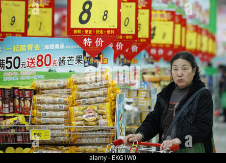 A Chinese costumer visit a supermarket at  a market  in Huaibei city, Anhui province, east China on 10th April 2015.China’s consumer price index (CPI) rose 1.4 per cent year-on-year in March, slightly more than expectations.The rise in the CPI followed a 1.4 percent rise in February, according to figures provided by the National Bureau of Statistics on Friday. Stock Photo