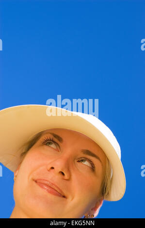 Funny girl's face isolated over blue Stock Photo