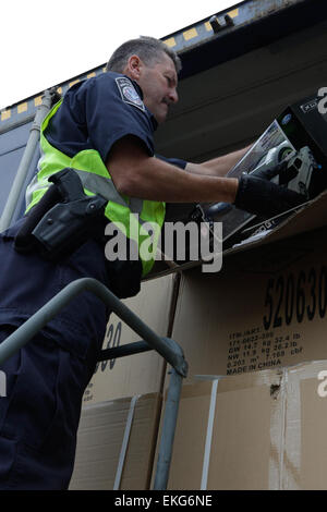 US Customs and Border Protection Field Officer conducts inspection of vehicle at a port of entry in Seattle, Washington.  Donna Burton Stock Photo