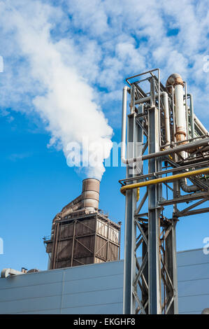 Chemical plant for the treatment of chipboard for furniture factory, with chimney Stock Photo