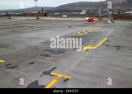 direction of drive arrow on empty upper floor of a multi storey car park in the uk Stock Photo
