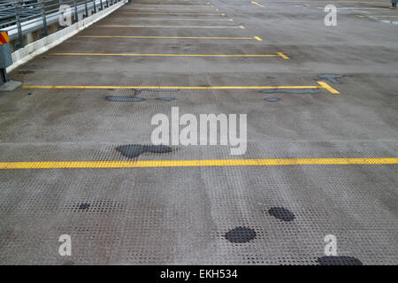 parking bays on empty upper floor of a multi storey car park in the uk Stock Photo