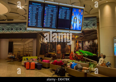 Passengers sleeping at Chhatrapati Shivaji International Airport in Mumbai, India Stock Photo