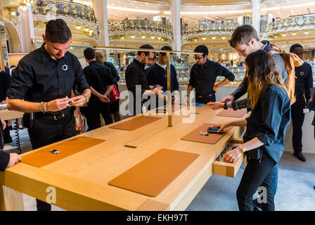 Paris, France. New Apple Corp. Store in French Department Store, 'Galeries Lafayette' for I-Watch Group of French Customers Looking at Products, Shop Clerk, shopper choosing goods, apple boutique Stock Photo