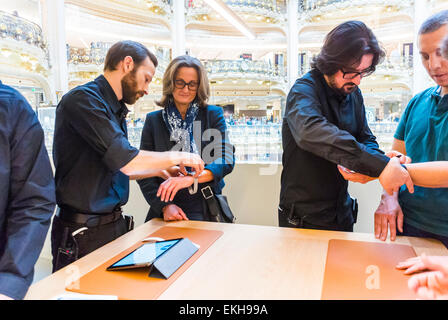 Paris, France. Customers Trying Apple Corp. Store in French Department Store, Galeries Lafayette for Watch products, Shop Clerk People using new exciting technology. apple customer Stock Photo