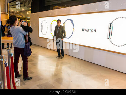 Paris, France.  Apple Corp. Store Opens in French Department Store, Galeries Lafayette for I-Watch products, Chinese Woman Taking Photos, Sign, apple customer, advertising and store Stock Photo