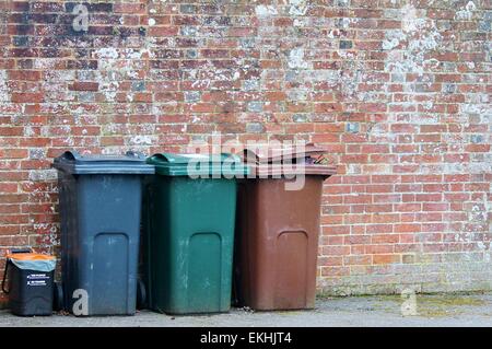 dustbins outside against brick wall trash, can, bin, dustbin, street ...