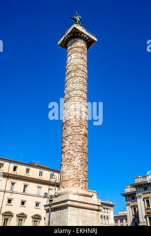 Rome, Italy. Column of Marcus Aurelius stood in Piazza Colonna since 193AD, with bronze statue of Saint Paul. Stock Photo