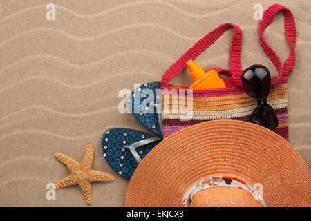 Accessories for the beach  lying on the sand, with place for your text Stock Photo