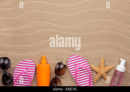 Accessories for the beach  lying on the sand, with place for your text Stock Photo