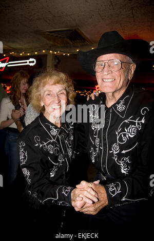 Boot-scooters of all ages enjoy the music and dancing at the Broken Spoke in Austin, Texas, USA Stock Photo