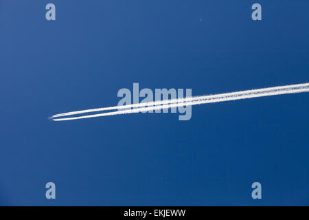 Chemtrail or Vapor trail depending of your opinion ! Stock Photo
