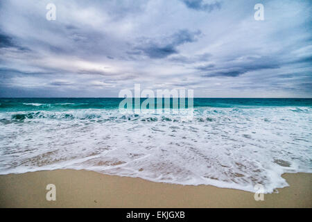 Agitated Sea and Waves and Bad Weather on the beach in Vacation Stock Photo