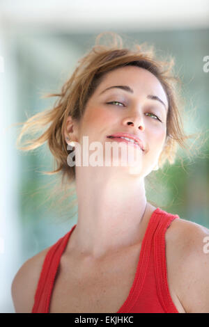 Colorful young woman smiling Stock Photo