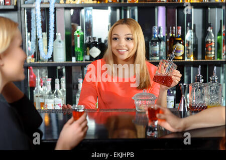 Female bartender makes cocktails Stock Photo