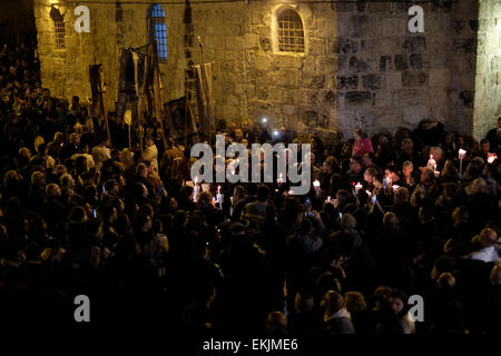 Coptic worshipers surrounding the parvis or parvise of the Church of Holy Sepulchre during a Coptic orthodox re-enactment of Jesus's funeral on Orthodox Good Friday ceremony in the Christian Quarter old city of Jerusalem Israel Stock Photo