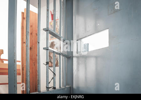 Heroines of solitude Women posters behind the bars. Stock Photo