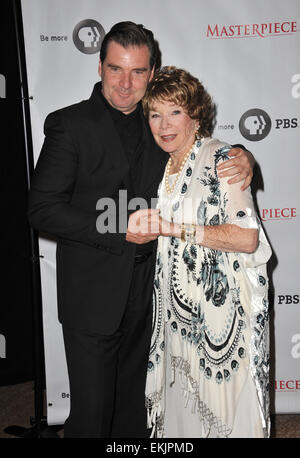 LOS ANGELES, CA - JULY 22, 2012: Brendan Coyle & Shirley MacLaine at photocall for the third series of Downton Abbey at the Beverly Hilton Hotel. Stock Photo