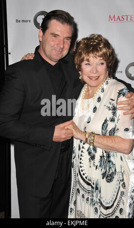 LOS ANGELES, CA - JULY 22, 2012: Brendan Coyle & Shirley MacLaine at photocall for the third series of Downton Abbey at the Beverly Hilton Hotel. Stock Photo
