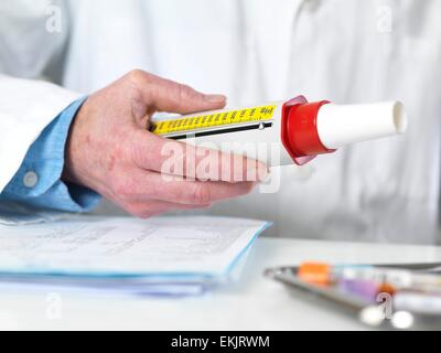 breathing test, capacity, check-up, device, diagnosis, diagnostic, equipment, exhalation, healthcare, lung function, male, measurement, medical, medicine, peak flow meter, spirometer Stock Photo